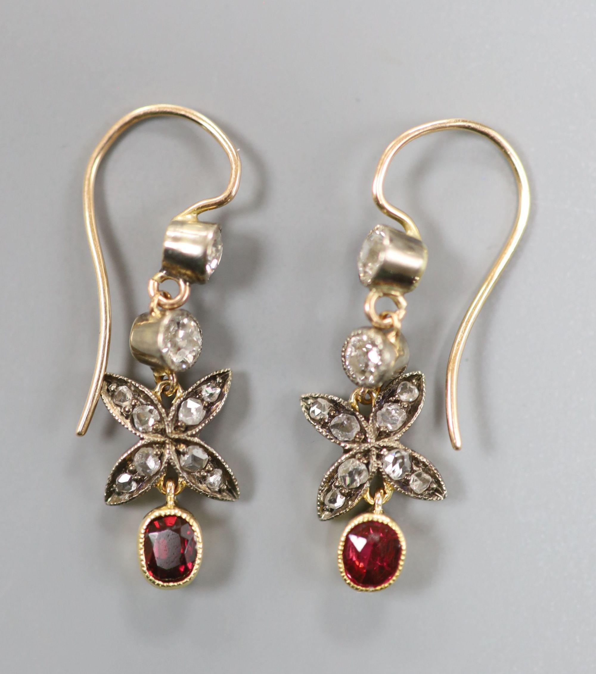 A pair of Victorian yellow and white metal, garnet and round and rose cut diamond set drop earrings, 29mm, gross 2.2 grams.